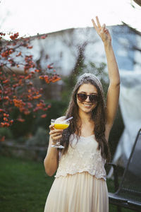 Portrait of young woman with autumn leaves