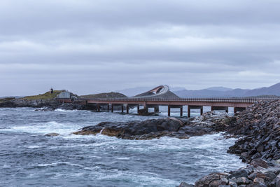 Bridge over sea against sky