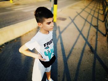 High angle view of cute boy standing outdoors