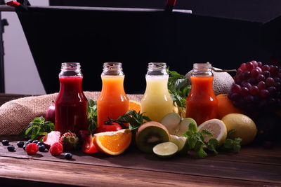 Various fruits in glass on table