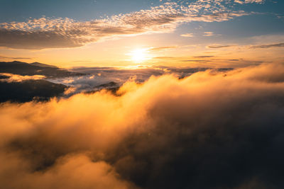 Low angle view of dramatic sky during sunset