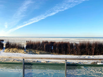 Scenic view of sea against sky during winter