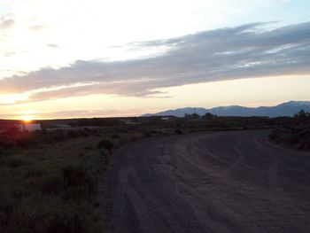 Scenic view of landscape against sky during sunset