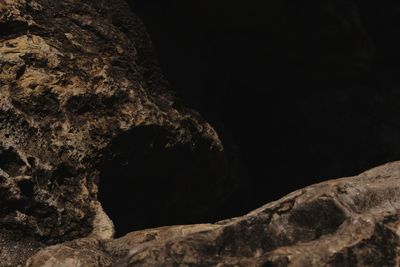 Low angle view of rock formation at night