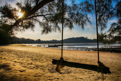 Scenic view of beach against sky during sunset