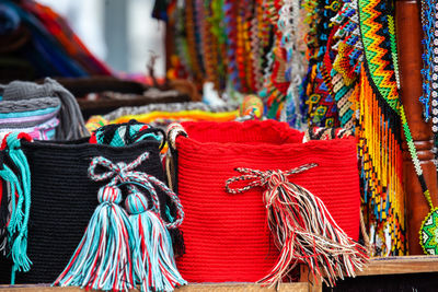 Hand made traditional colombian mochilas and necklaces at caldas square in the centerof popayan