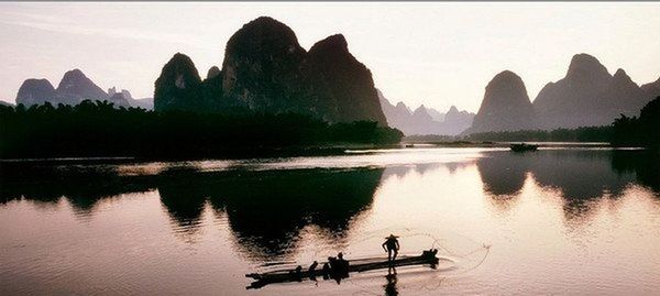 Scenic view of lake at sunset