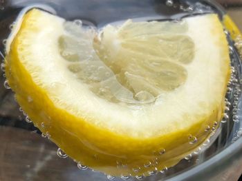 Close-up of lemon slice in glass
