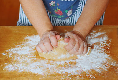 Midsection of woman preparing food