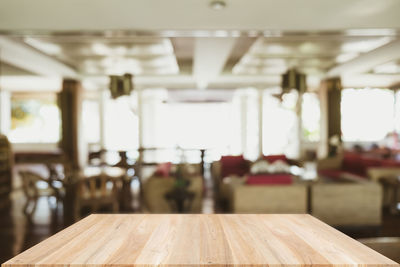 Empty chairs and tables in restaurant