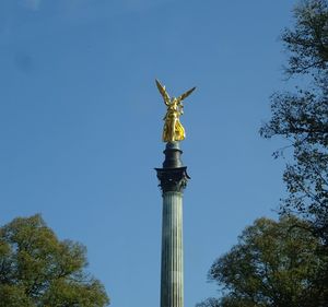 Low angle view of statue against sky