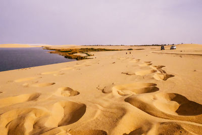 Scenic view of beach against clear sky