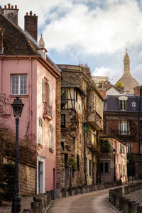Buildings in city against sky