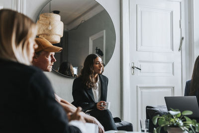 Coworkers having meeting in office