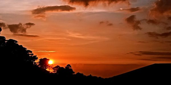 Scenic view of dramatic sky during sunset