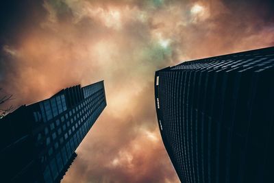 Low angle view of building against cloudy sky