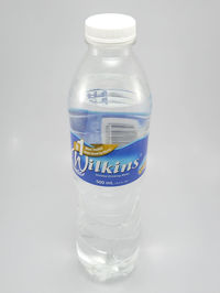 Close-up of water bottle against white background