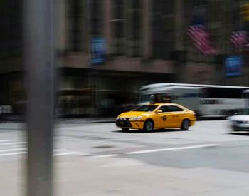 Blurred motion of car on road