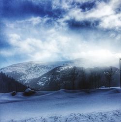 Scenic view of snow covered mountains