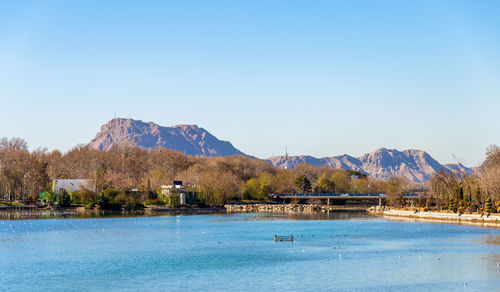 Scenic view of swimming pool against clear blue sky