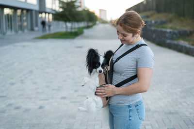 Portrait of young woman with dog