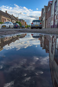 View of buildings against cloudy sky