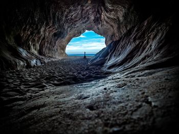 Scenic view of sea seen through cave