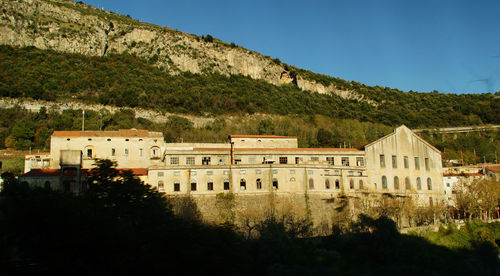 View of buildings against mountain range