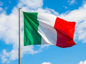 Low angle view of flag against sky