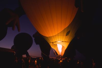 People in hot air balloon at night