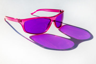Close-up of sunglasses against white background