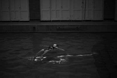 High angle view of woman swimming in sea