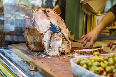 Man preparing food at market stall