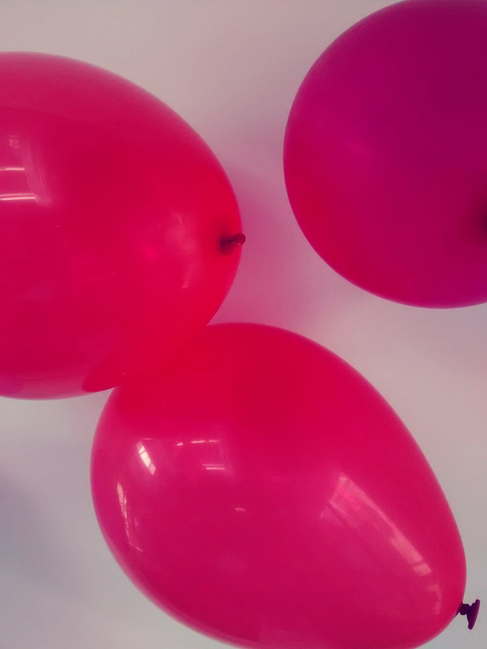 red, indoors, close-up, still life, toy, pink color, no people, table, childhood, copy space, single object, studio shot, day, vibrant color, focus on foreground, high angle view, two objects, plastic, part of, selective focus