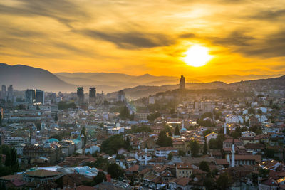 High angle view of city at sunset