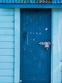 Scratched blue door