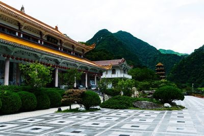 View of buildings against cloudy sky