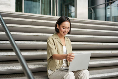 Young woman using mobile phone