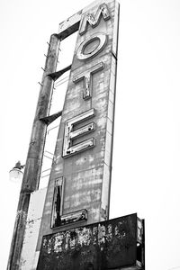 Low angle view of abandoned building against clear sky