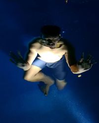 Man swimming in pool