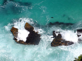 Waves splashing on rocks