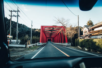 View of bridge through car windshield