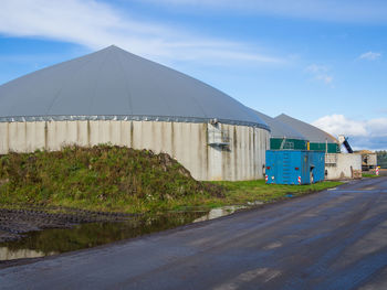 Biogas energy power plant against clear sky in germany