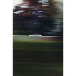 Blurred motion of car on grass