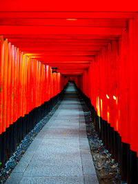 Empty footpath leading towards temple in building