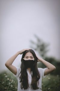 Portrait of a beautiful young woman in the background