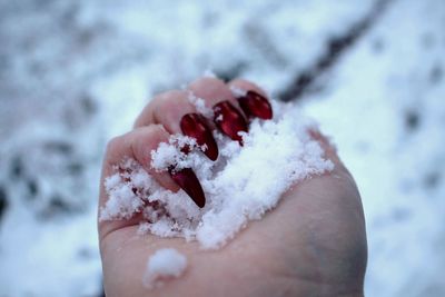 Close-up of hand holding ice cream