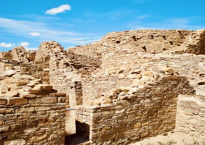 Low angle view of old ruins against sky