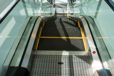 Escalator perspective moving staircase in bangkok, thailand.