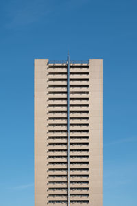 Low angle view of building against clear blue sky